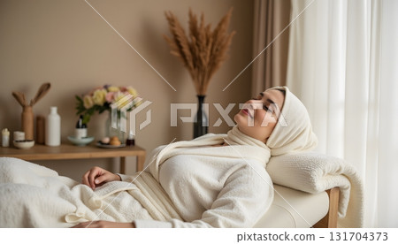 Relaxed Woman Enjoying Spa Treatment in Serene Indoor Environment with Natural Decor 131704373