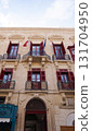 View of old building with windows, balconies in city. Republic of Malta, the picturesque city Valetta, Malta. 131704950