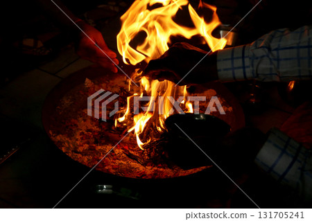 Sacred Fire Ritual in Hindu Puja Ceremony Sacred Fire Ritual in Hindu Puja Ceremony 131705241