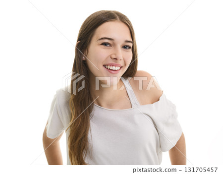 Portrait of teenage girl in casual t-shirt on light background in studio. Portrait of teenage girl in casual t-shirt on light background in studio. 131705457