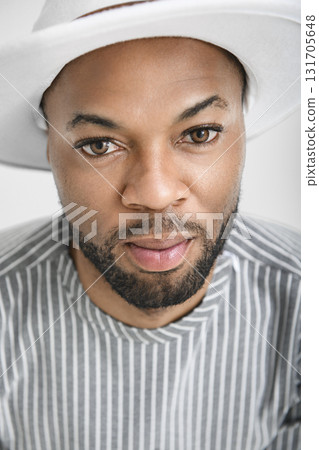 Portrait of black fashion American wearing great looking clothes with white hat Portrait of black fashion American wearing great looking clothes with white hat 131705648