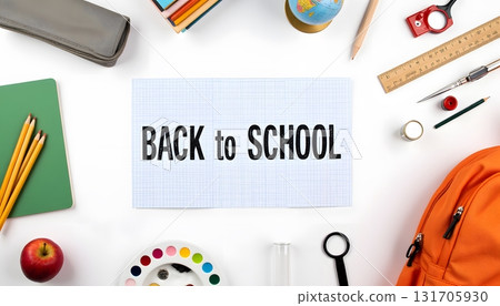 Colorful Back to School Essentials with Stationery and Backpack on a Table 131705930