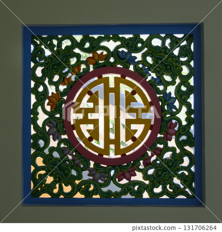 Grid with patterns and religious symbols in the temple of Khao Dai religion, unique to Vietnam Grid with patterns and religious symbols in the temple of Khao Dai religion, unique to Vietnam 131706264