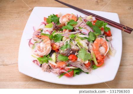 Thai and ethnic dishes include yam woon sen (homemade), and a salad of vermicelli, seafood, and coriander. Thai and ethnic dishes include yam woon sen (homemade), and a salad of vermicelli, seafood, and coriander. 131706303