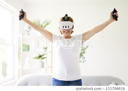nice senior woman play virtual reality game nice senior woman play virtual reality game 131706616