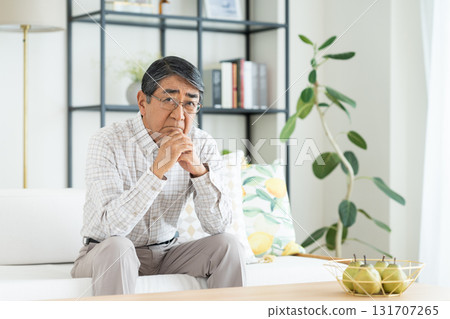 Senior man worried in the living room 131707265