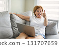 Happy modern European senior woman using laptop 131707659