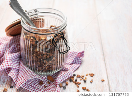 Homemade granola cereal with chocolate chips in jar 131707753