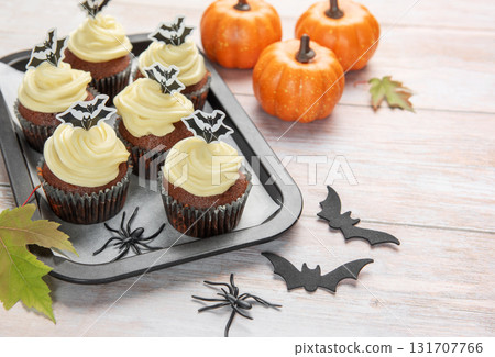 Halloween cupcakes decorated with bat and spider decorations Halloween cupcakes decorated with bat and spider decorations 131707766