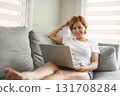 Happy modern European senior woman using laptop 131708284