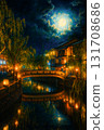 A fantastic autumn night view of Kinosaki Onsen town with willow trees and bridges illuminated by the full moon 131708686