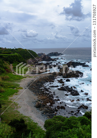 View from the Shionomisaki Lighthouse Observatory at the southernmost cape of Honshu: White waves crashing on the rocky shoreline① View from the Shionomisaki Lighthouse Observatory at the southernmost cape of Honshu: White waves crashing on the rocky shoreline① 131708927