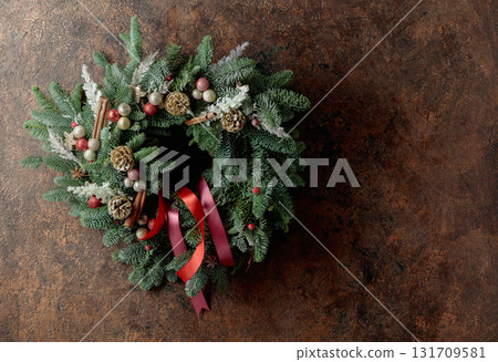 Christmas wreath on a brown vintage background. Christmas wreath on a brown vintage background. 131709581