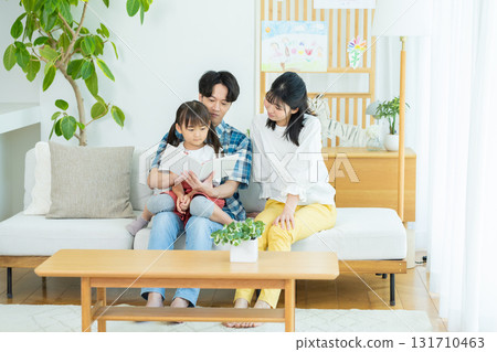 Families playing in the living room Families playing in the living room 131710463