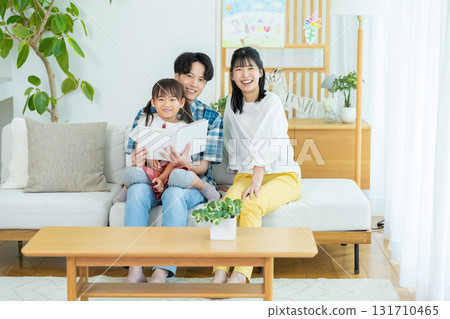 Families playing in the living room Families playing in the living room 131710465