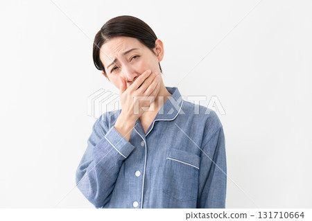 Woman wearing pajamas Lifestyle image 131710664