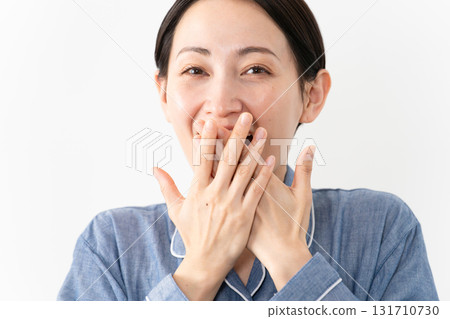Woman wearing pajamas Lifestyle image Woman wearing pajamas Lifestyle image 131710730
