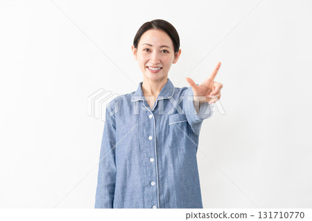 Woman wearing pajamas Lifestyle image Woman wearing pajamas Lifestyle image 131710770
