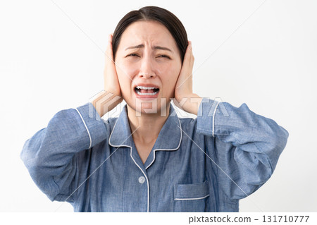 Woman wearing pajamas Lifestyle image 131710777