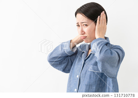 Woman wearing pajamas Lifestyle image 131710778