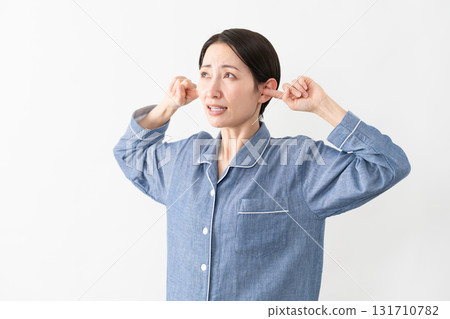 Woman wearing pajamas Lifestyle image 131710782