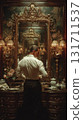 A man standing in front of a mirror in an antique-style room A man standing in front of a mirror in an antique-style room 131711537