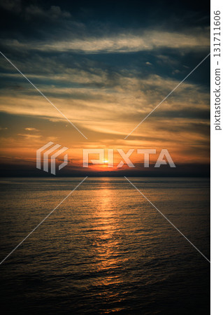 The end of the day as the sun sinks into the Sea of Okhotsk The end of the day as the sun sinks into the Sea of Okhotsk 131711606