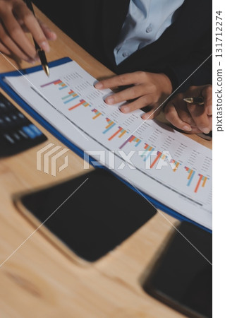 Accounting company provide finance and taxation planning for profitable cash flow, Auditor and accountant team working in office, analyze financial data and accounting record with calculator.Insight Accounting company provide finance and taxation planning for profitable cash flow, Auditor and accountant team working in office, analyze financial data and accounting record with calculator.Insight 131712274