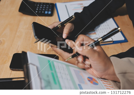 Accounting company provide finance and taxation planning for profitable cash flow, Auditor and accountant team working in office, analyze financial data and accounting record with calculator.Insight Accounting company provide finance and taxation planning for profitable cash flow, Auditor and accountant team working in office, analyze financial data and accounting record with calculator.Insight 131712276