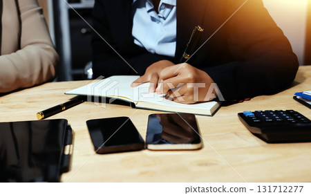 Accounting company provide finance and taxation planning for profitable cash flow, Auditor and accountant team working in office, analyze financial data and accounting record with calculator.Insight 131712277