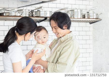A couple feeding their baby food A couple feeding their baby food 131712750
