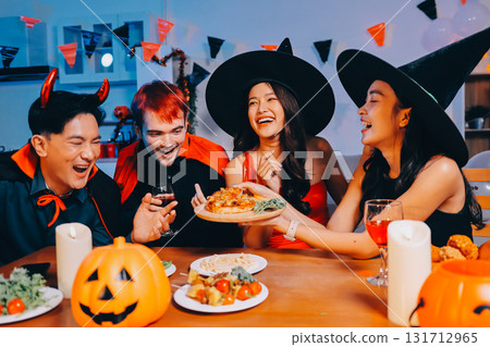 Joyful office Halloween party with coworkers in costumes, celebrating with drinks and laughter, fostering teamwork and festive spirit Joyful office Halloween party with coworkers in costumes, celebrating with drinks and laughter, fostering teamwork and festive spirit 131712965