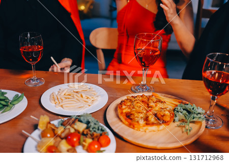 Joyful office Halloween party with coworkers in costumes, celebrating with drinks and laughter, fostering teamwork and festive spirit Joyful office Halloween party with coworkers in costumes, celebrating with drinks and laughter, fostering teamwork and festive spirit 131712968