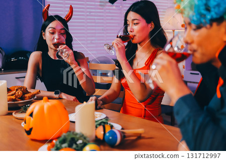 Joyful office Halloween party with coworkers in costumes, celebrating with drinks and laughter, fostering teamwork and festive spirit Joyful office Halloween party with coworkers in costumes, celebrating with drinks and laughter, fostering teamwork and festive spirit 131712997