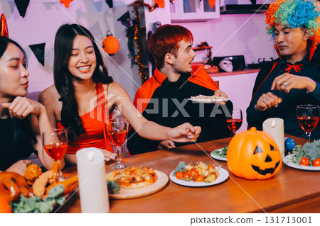 Joyful office Halloween party with coworkers in costumes, celebrating with drinks and laughter, fostering teamwork and festive spirit Joyful office Halloween party with coworkers in costumes, celebrating with drinks and laughter, fostering teamwork and festive spirit 131713001