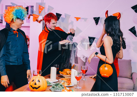 Joyful office Halloween party with coworkers in costumes, celebrating with drinks and laughter, fostering teamwork and festive spirit Joyful office Halloween party with coworkers in costumes, celebrating with drinks and laughter, fostering teamwork and festive spirit 131713007