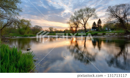 Beautiful sunset reflecting on a calm river in a serene natural setting Beautiful sunset reflecting on a calm river in a serene natural setting 131713117