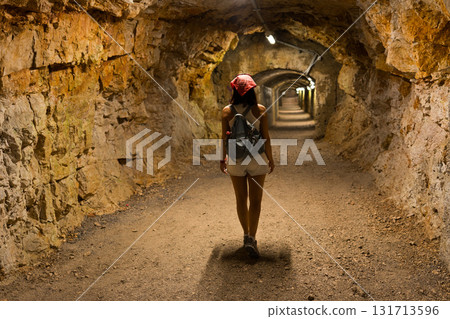 Woman exploring Gric tunnel Rijeka embarking on adventure Woman exploring Gric tunnel Rijeka embarking on adventure 131713596
