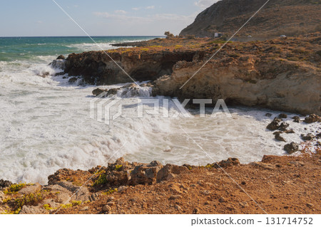 Mediterranean seascape during windy but sunny weather with waves breaking on the shore. Mediterranean seascape during windy but sunny weather with waves breaking on the shore. 131714752