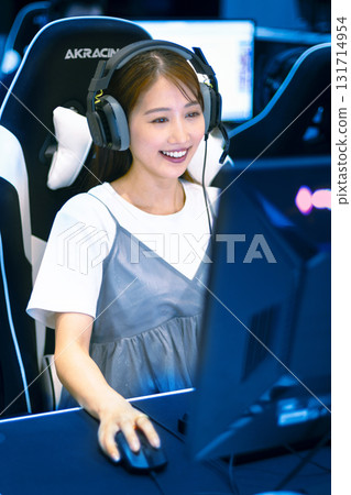 E-sports woman playing online games E-sports woman playing online games 131714954