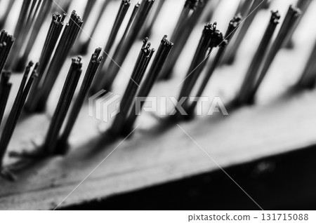 The hard metal brush is set against a dark background 131715088