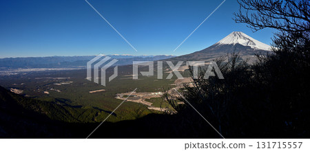 A panoramic photo of Suruga Bay, the Southern Alps in midwinter, and snow-capped Mount Fuji from Mount Echizen in the Ashitaka mountain range. A panoramic photo of Suruga Bay, the Southern Alps in midwinter, and snow-capped Mount Fuji from Mount Echizen in the Ashitaka mountain range. 131715557