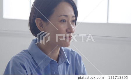 Woman listening to a presentation image 131715895