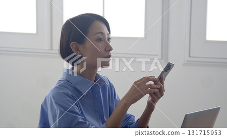 Woman in a meeting Woman in a meeting 131715953