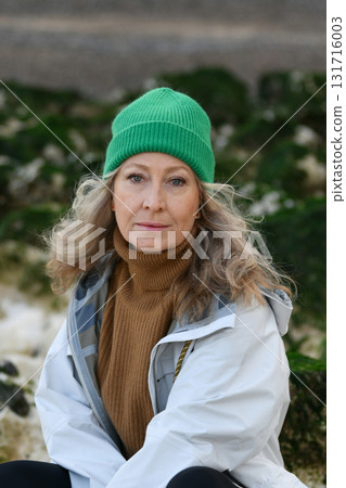 Portrait of a sixty-year-old woman with a snow-white smile 131716003