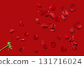 A floral background with scattered red rose petals 131716024