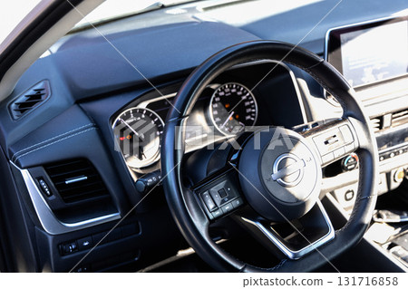 Modern vehicle cockpit showing steering and controls Modern vehicle cockpit showing steering and controls 131716858