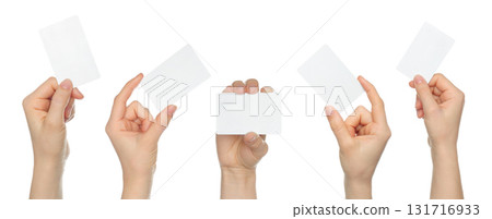 Set of human hand holding blank white business card isolated on transparent background Set of human hand holding blank white business card isolated on transparent background 131716933