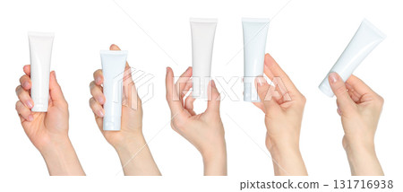Set of hand holding white blank cosmetic cream tube isolated on transparent background Set of hand holding white blank cosmetic cream tube isolated on transparent background 131716938