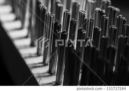 A close-up view of the metal brush showing the dense bristles 131717264
